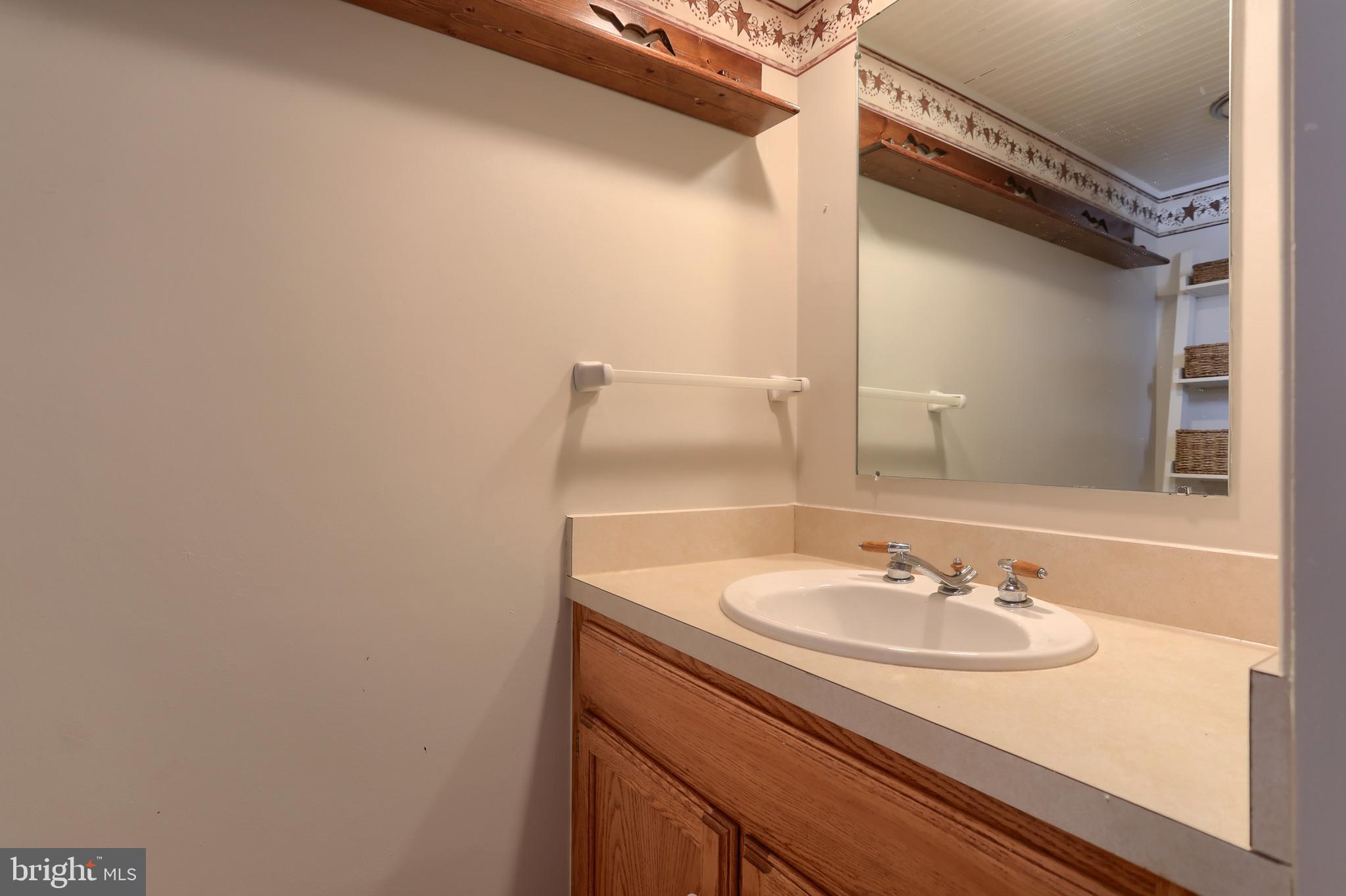 323 South 3rd Avenue Lebanon, PA 17042 - Photo 26 of 33 a bathroom with a sink and a mirror