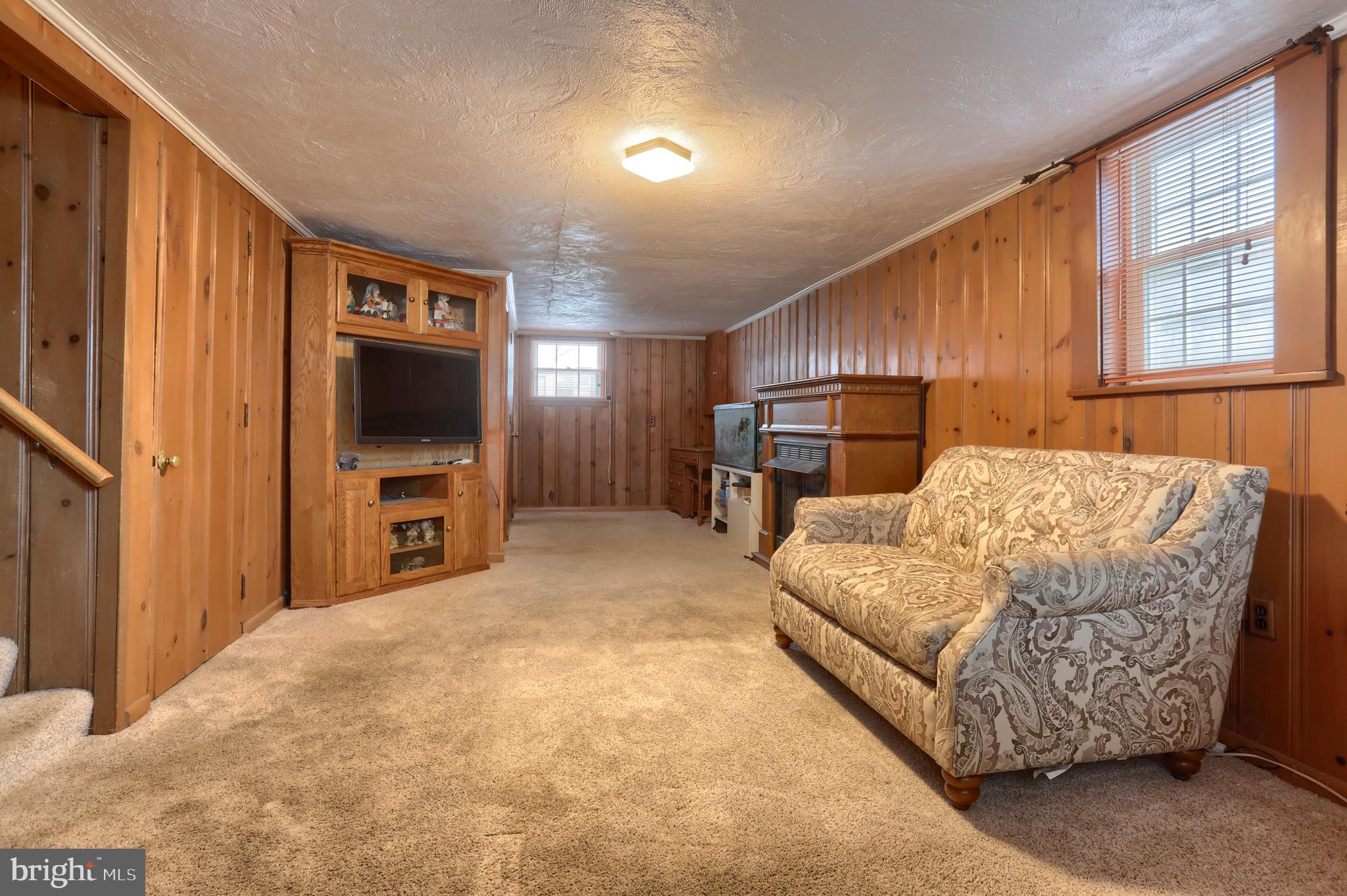 323 South 3rd Avenue Lebanon, PA 17042 - Photo 10 of 33 a bedroom with furniture and a flat screen tv