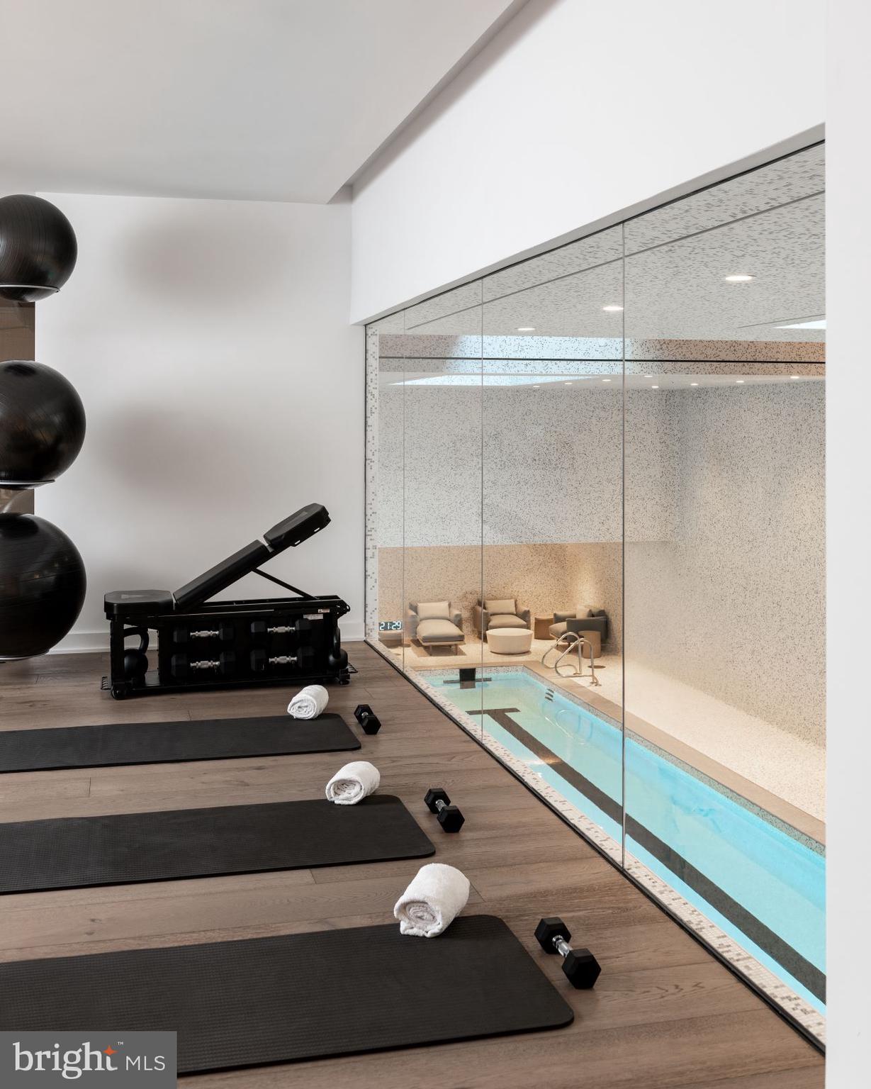 601 Wharf Street Southwest, Unit 905 Washington, DC 20024 - Photo 26 of 28 a room with gym equipment and a rug
