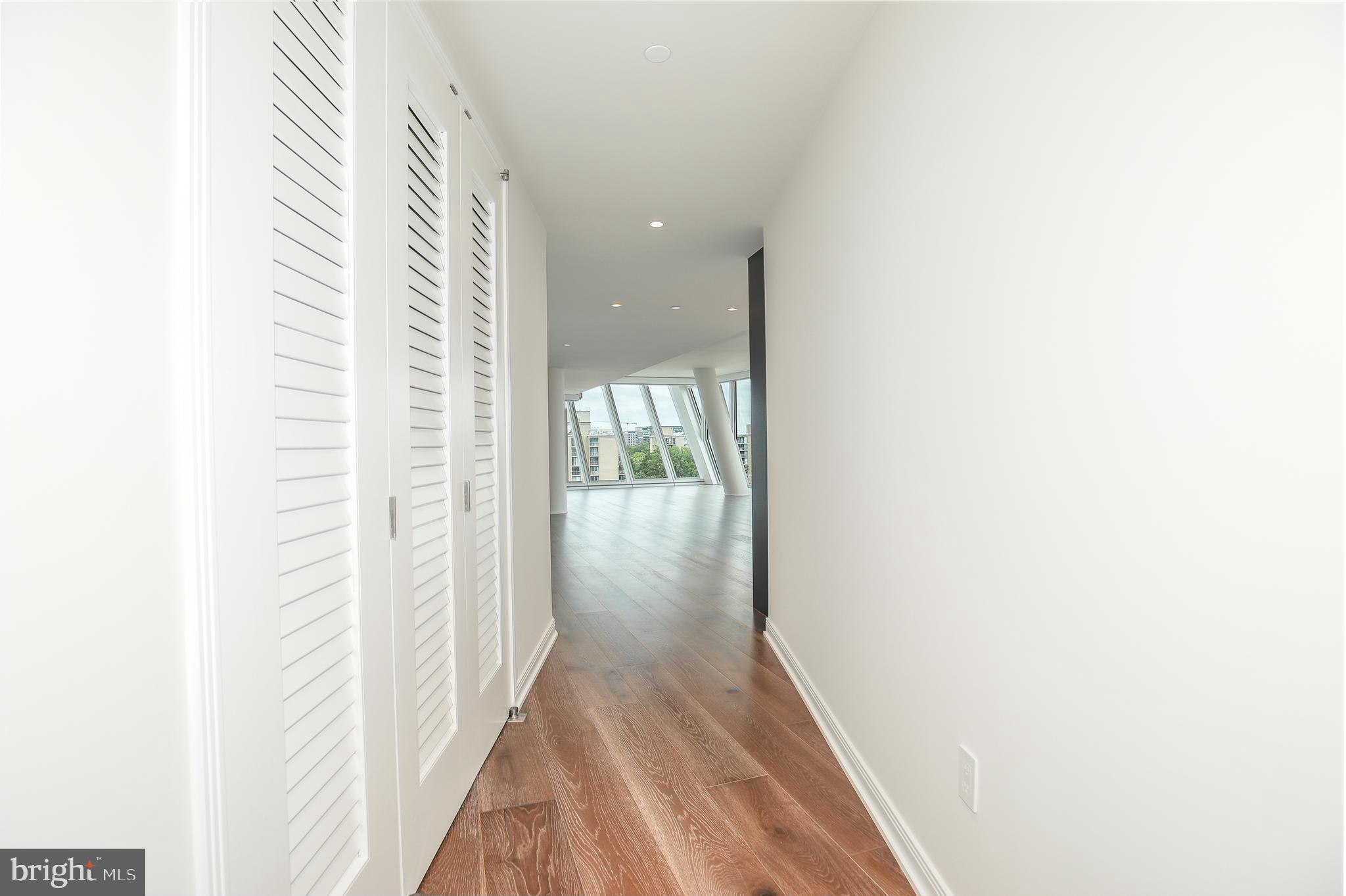 601 Wharf Street Southwest, Unit 905 Washington, DC 20024 - Photo 3 of 28 a view of a hallway with wooden floor