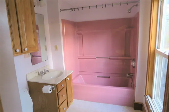 a bathroom with a sink a vanity and a mirror