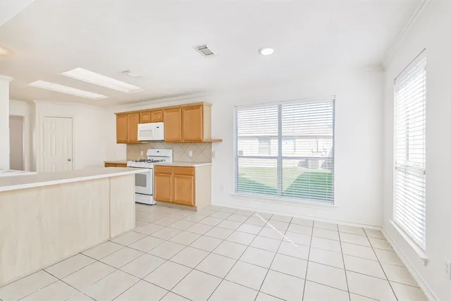 a view of an empty room with glass door