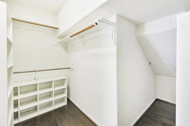 a white bath tub sitting next to a shower