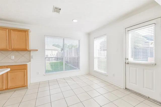 a kitchen with a sink cabinets and stainless steel appliances