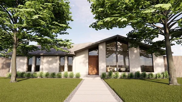a front view of a house with a yard and potted plants