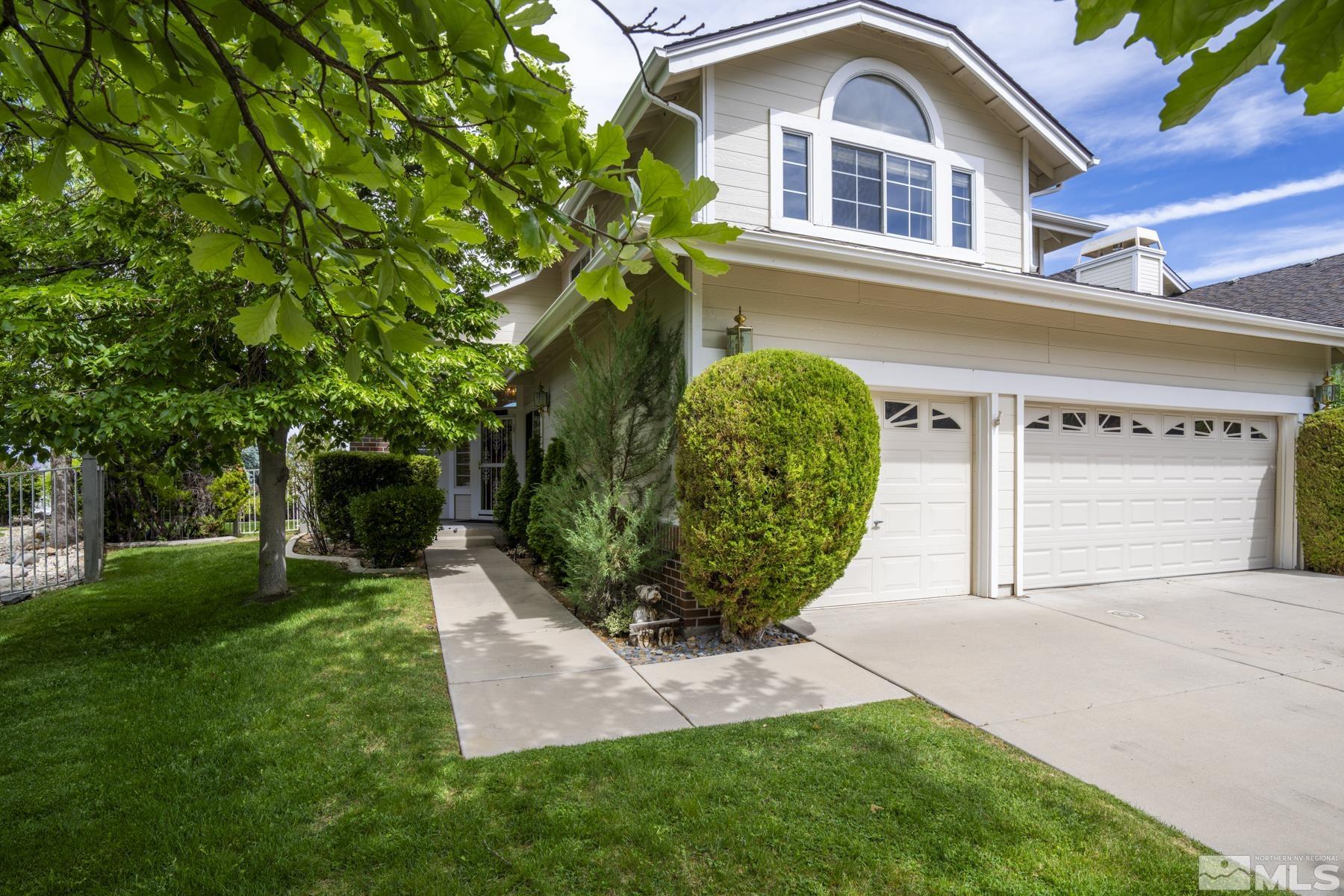 6172 Squires Lane Reno, NV 89519 - Photo 1 of 40 a front view of a house with garden