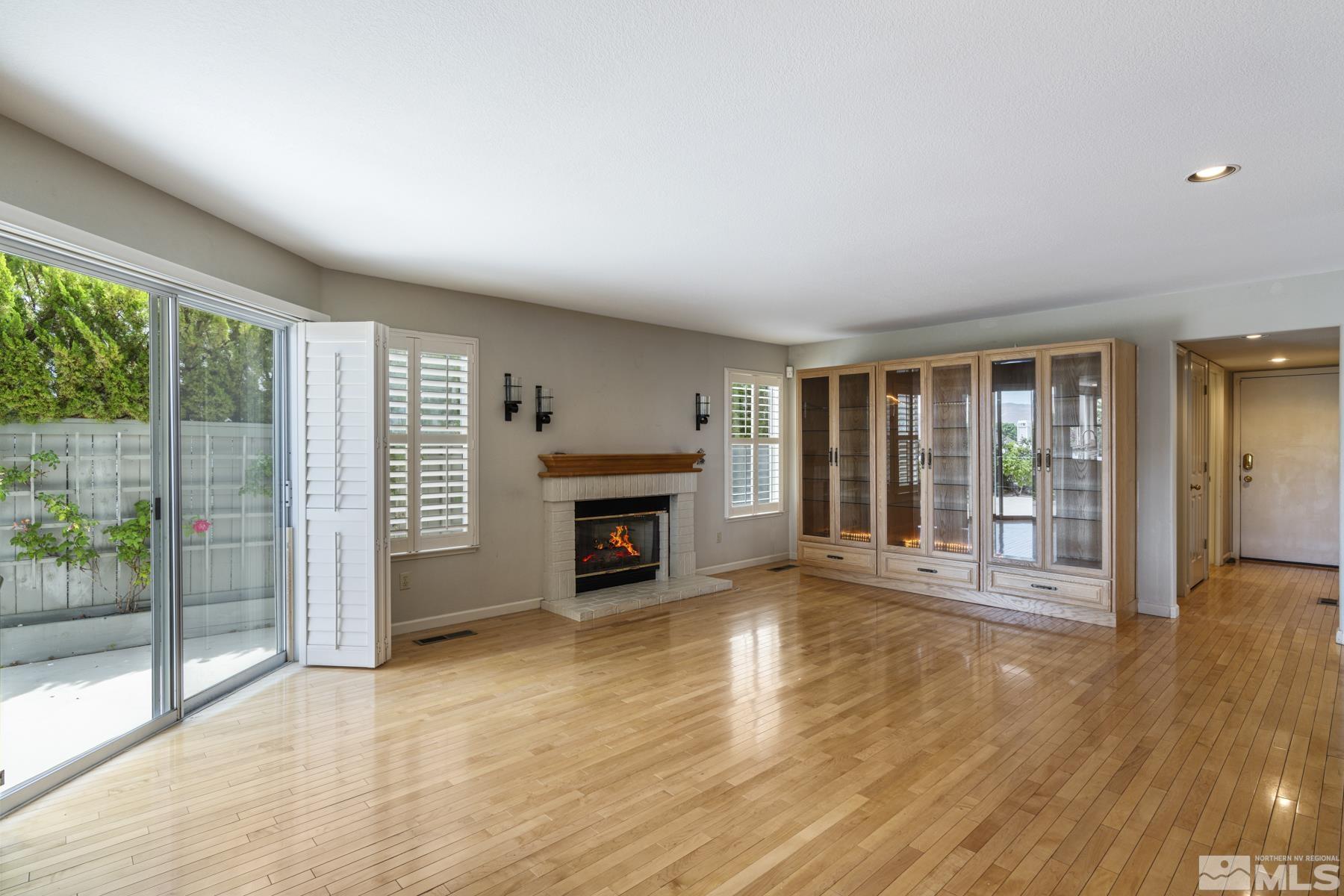 6172 Squires Lane Reno, NV 89519 - Photo 12 of 40 a view of an empty room with glass door and balcony