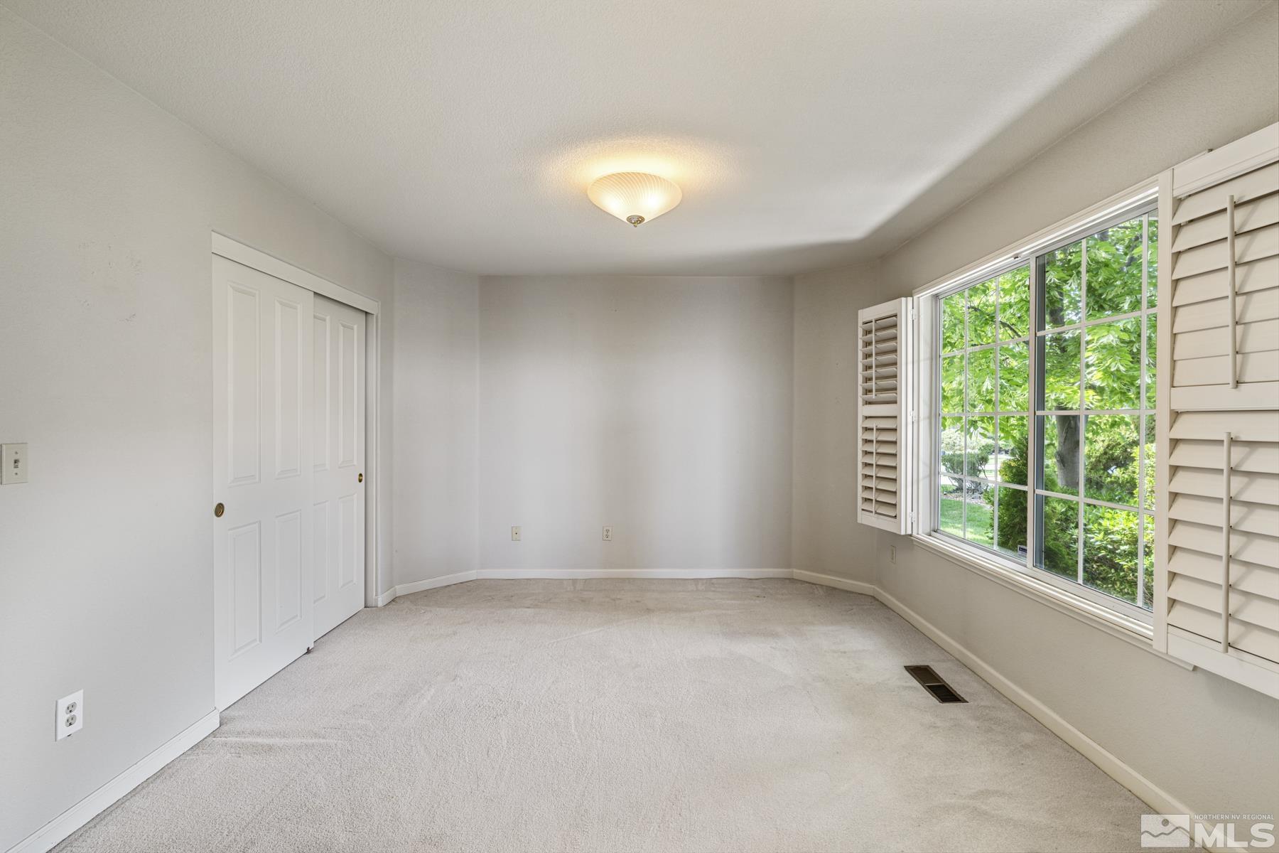 6172 Squires Lane Reno, NV 89519 - Photo 19 of 40 a view of an empty room with a window