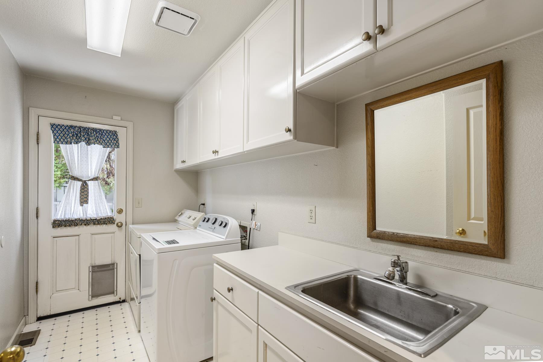6172 Squires Lane Reno, NV 89519 - Photo 21 of 40 a utility room with sink dryer and washer