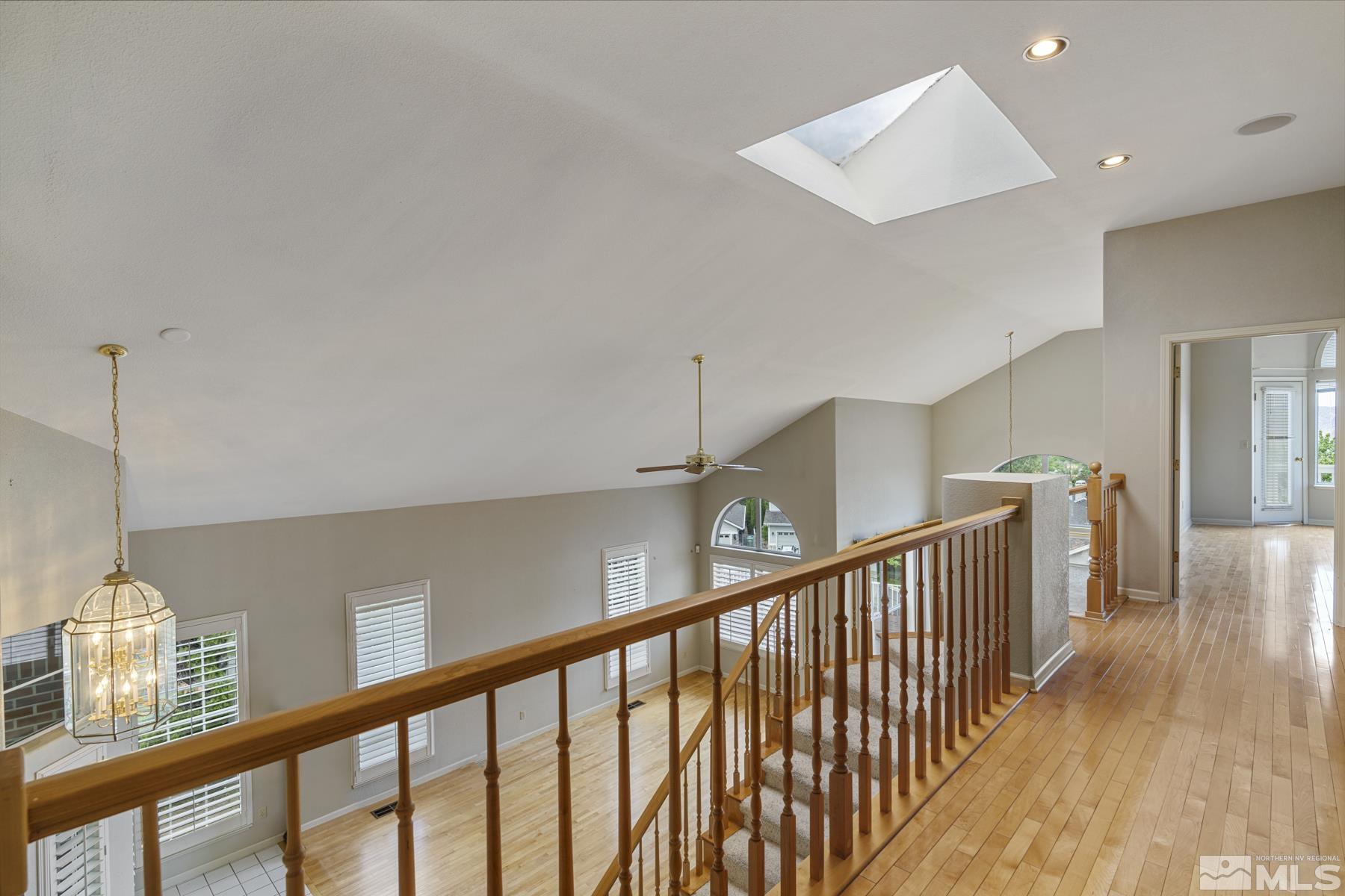 6172 Squires Lane Reno, NV 89519 - Photo 26 of 40 a view of a hallway with wooden floor
