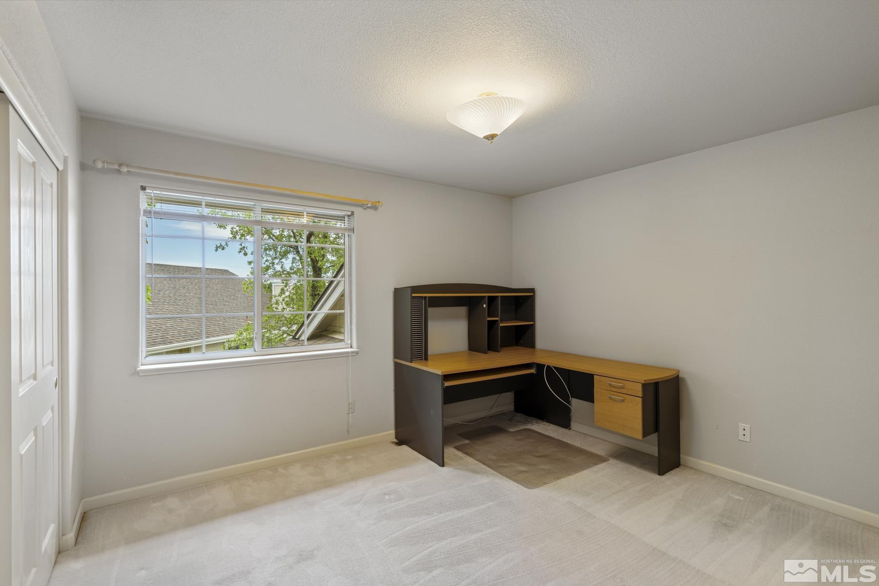 6172 Squires Lane Reno, NV 89519 - Photo 28 of 40 a room with furniture and a window