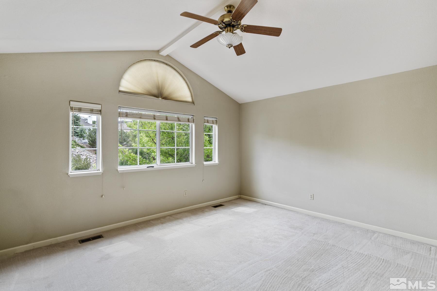 6172 Squires Lane Reno, NV 89519 - Photo 29 of 40 an empty room with windows and fan