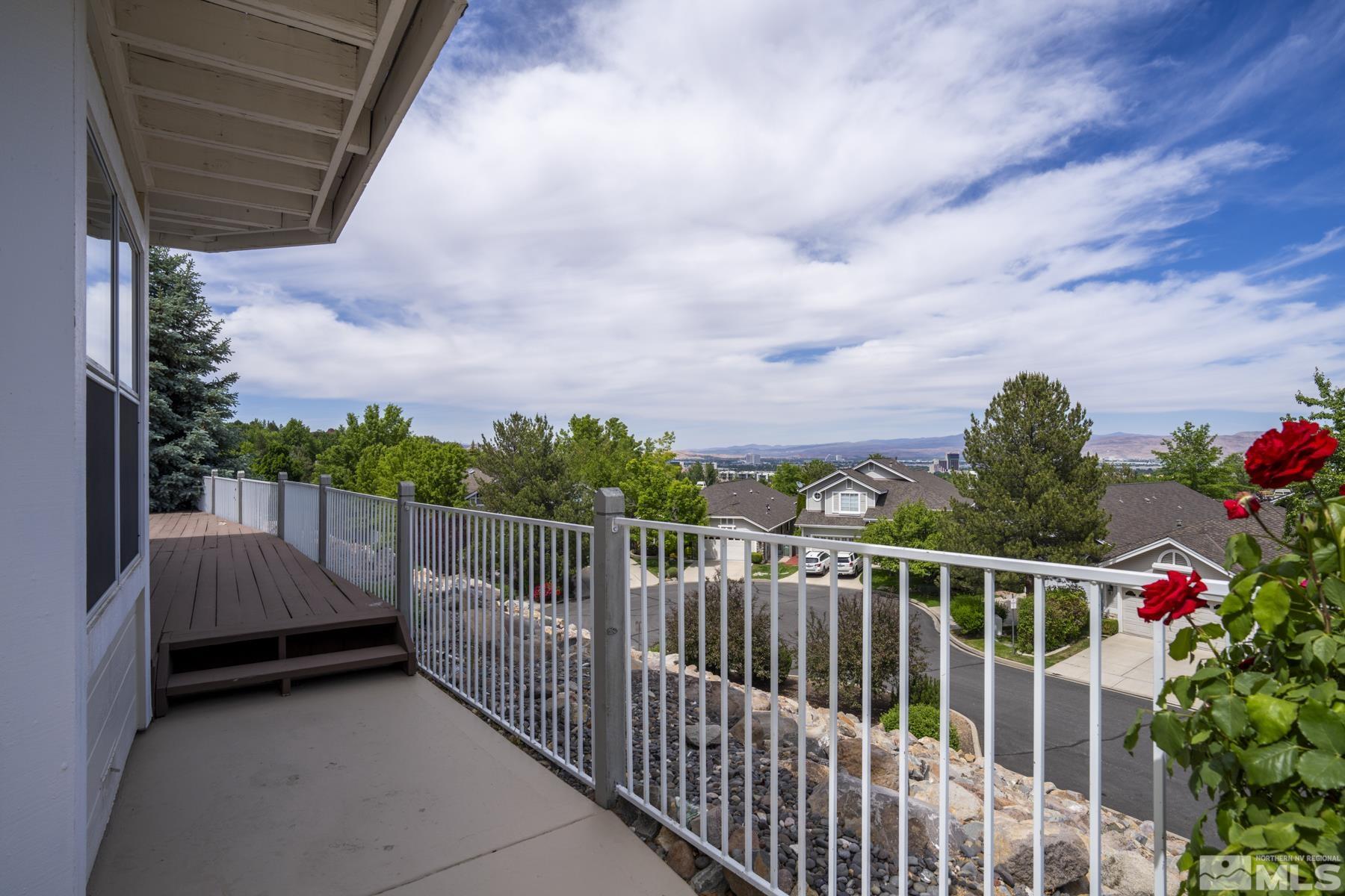 6172 Squires Lane Reno, NV 89519 - Photo 31 of 40 a balcony with wooden floor and city view