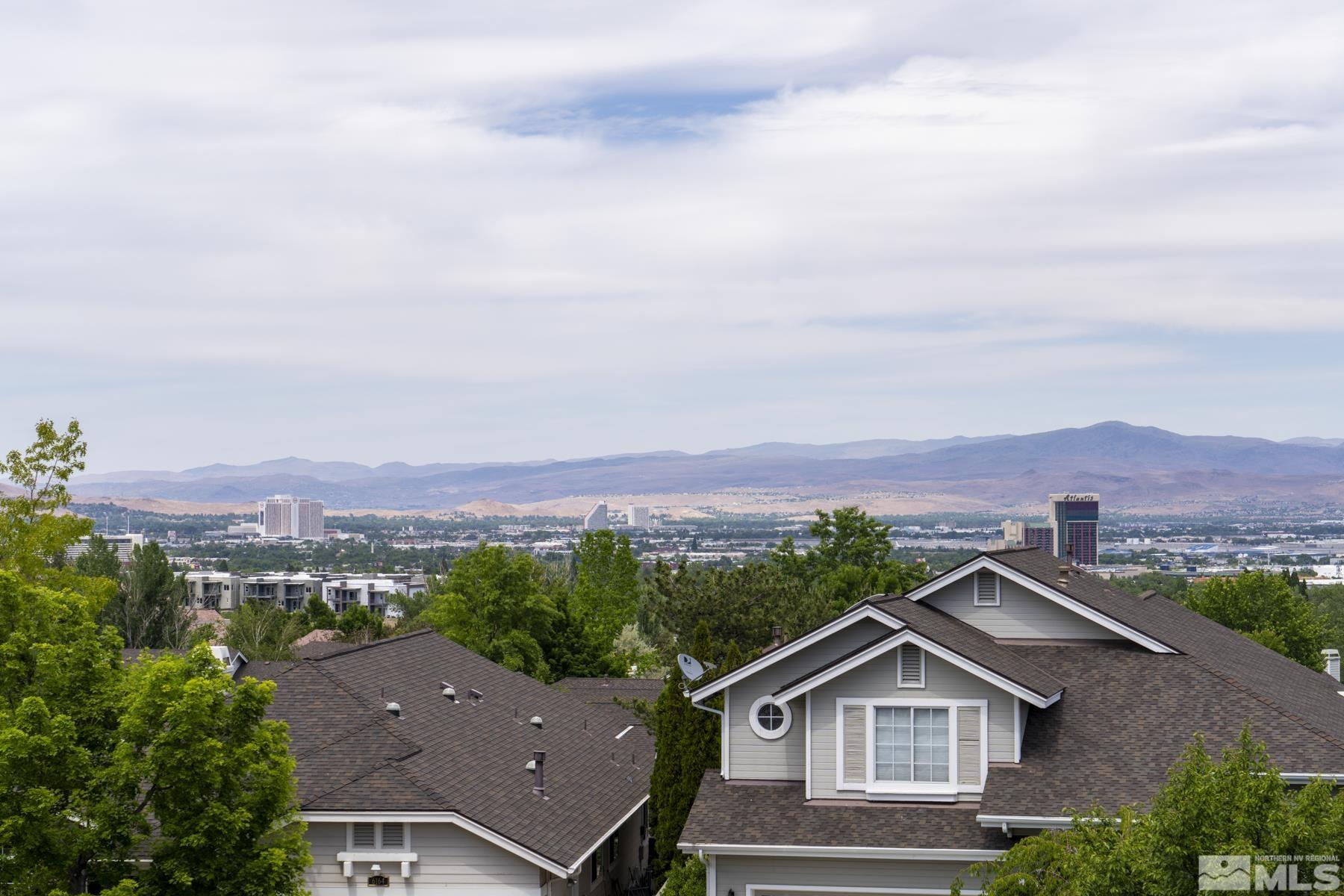 6172 Squires Lane Reno, NV 89519 - Photo 34 of 40 an aerial view of residential houses with a city view