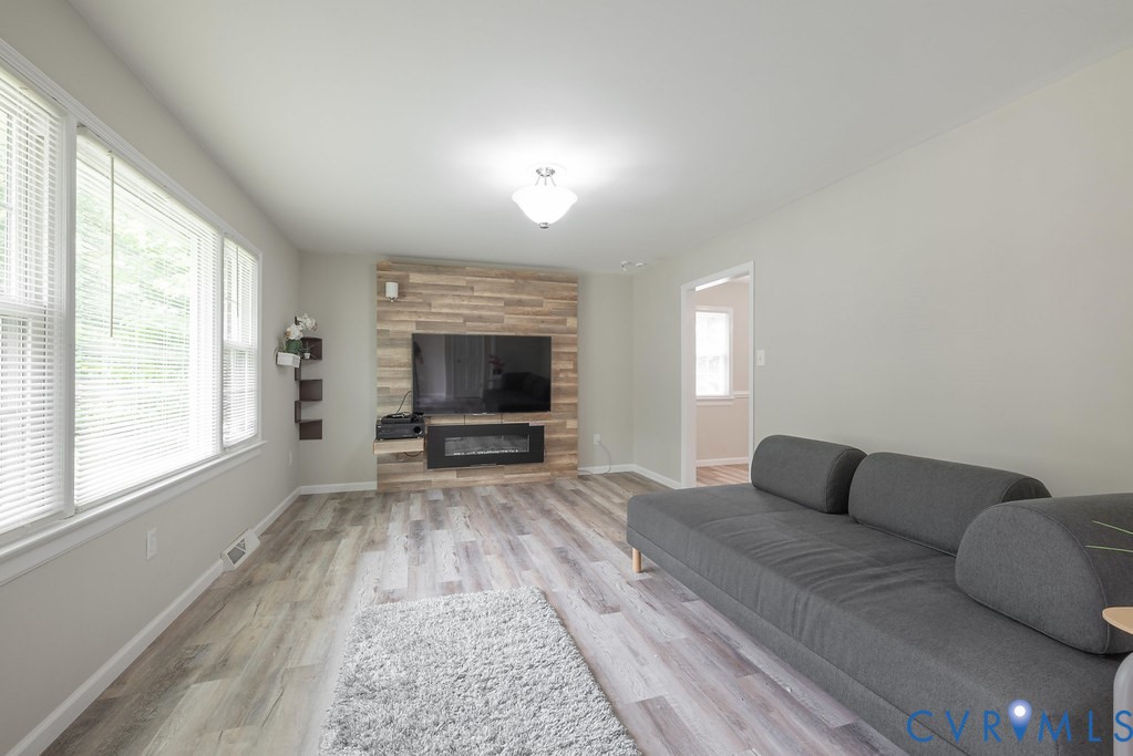 6901 Manning Road Chesterfield, VA 23832 - Photo 24 of 57 Living area featuring wood-finish flooring, a deco