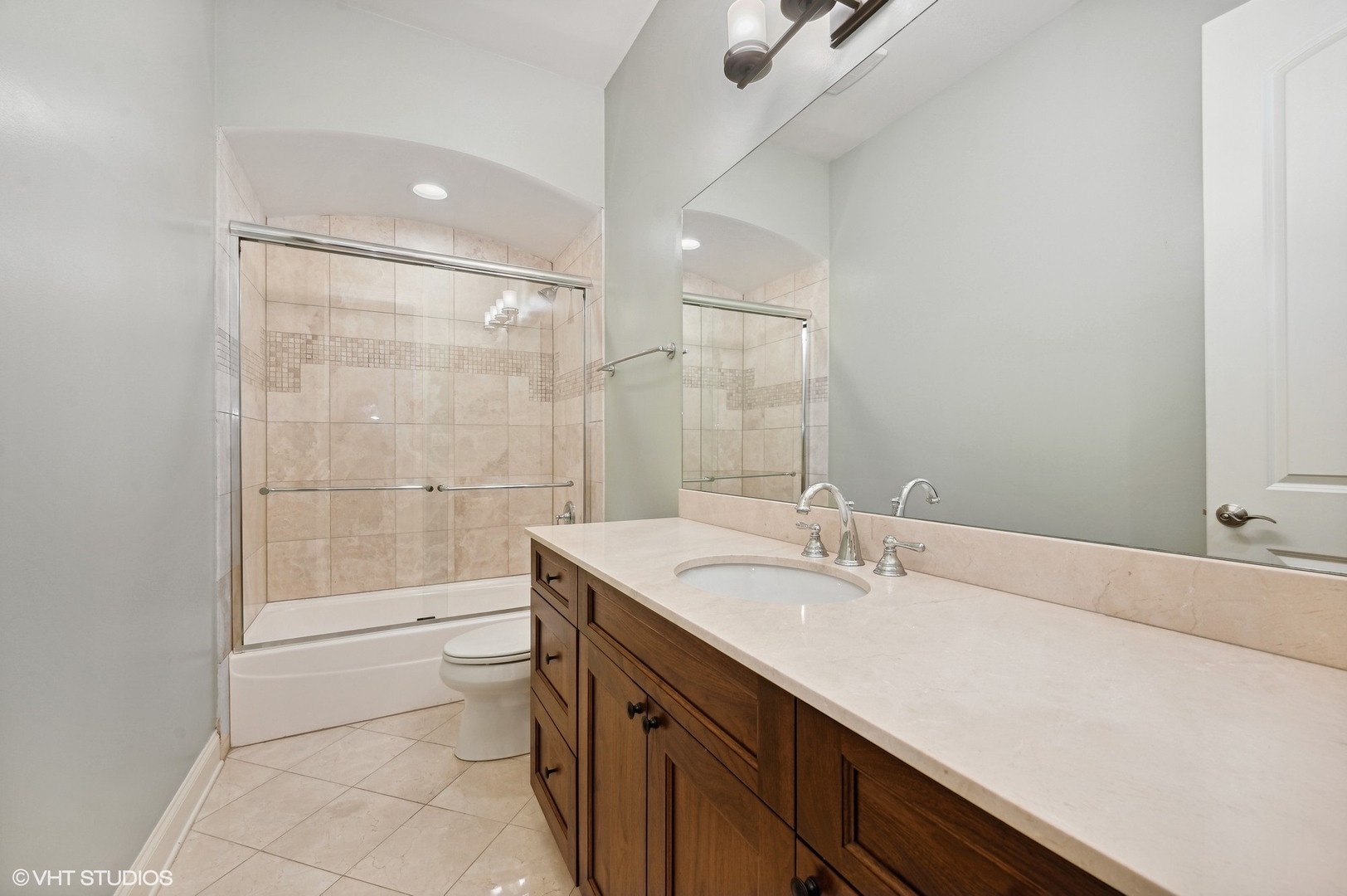 106 South Sangamon Street, Unit 3S Chicago, IL 60607 - Photo 15 of 20 a bathroom with a sink a toilet and shower
