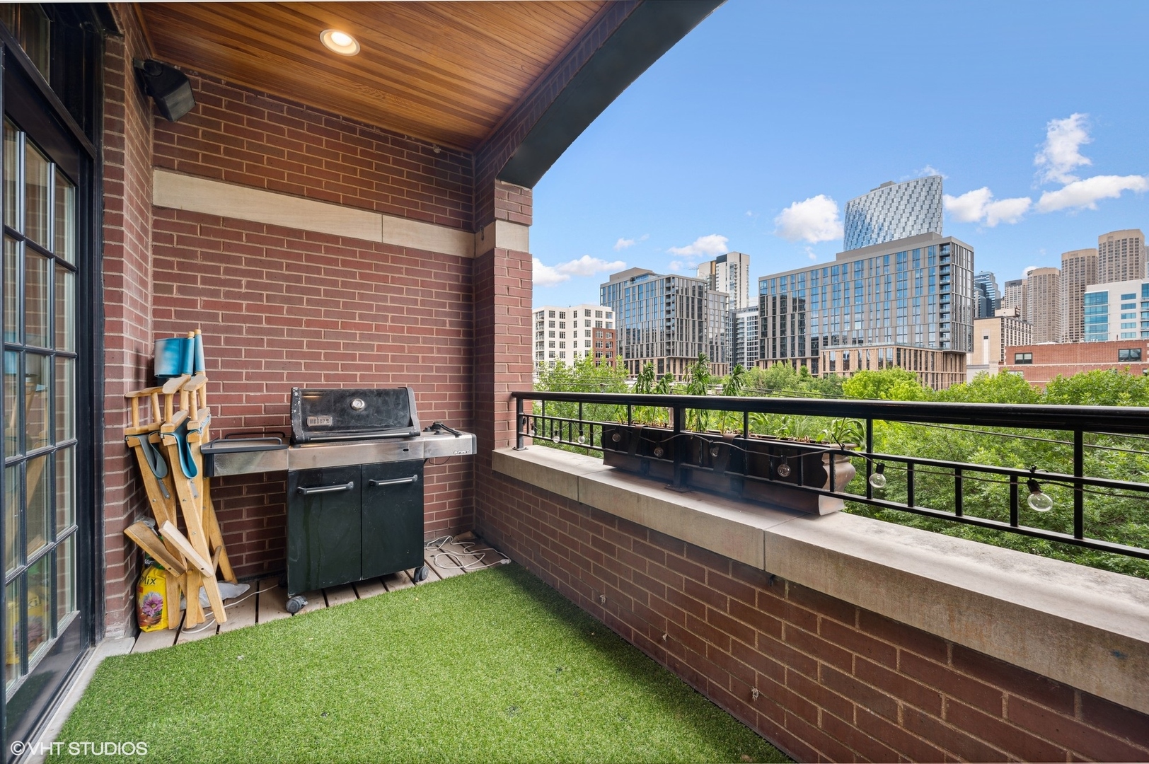 106 South Sangamon Street, Unit 3S Chicago, IL 60607 - Photo 19 of 20 a view of a balcony with two chairs and a table