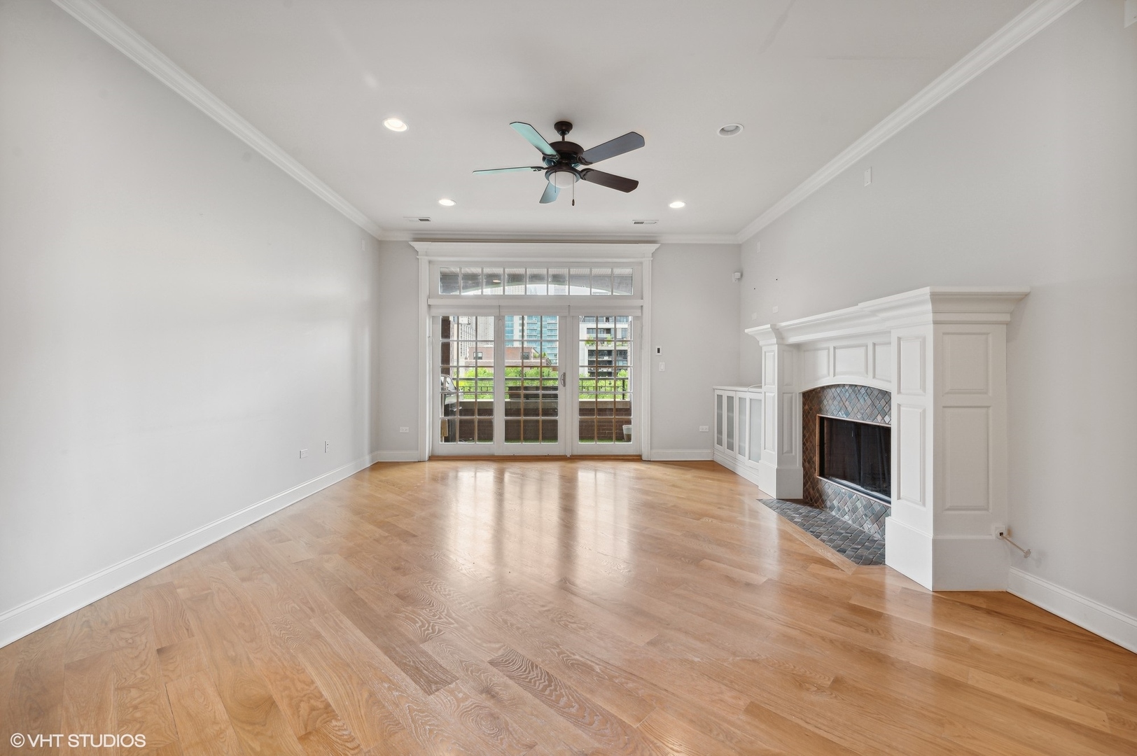 106 South Sangamon Street, Unit 3S Chicago, IL 60607 - Photo 4 of 20 a view of an empty room with wooden floor fireplace and a window