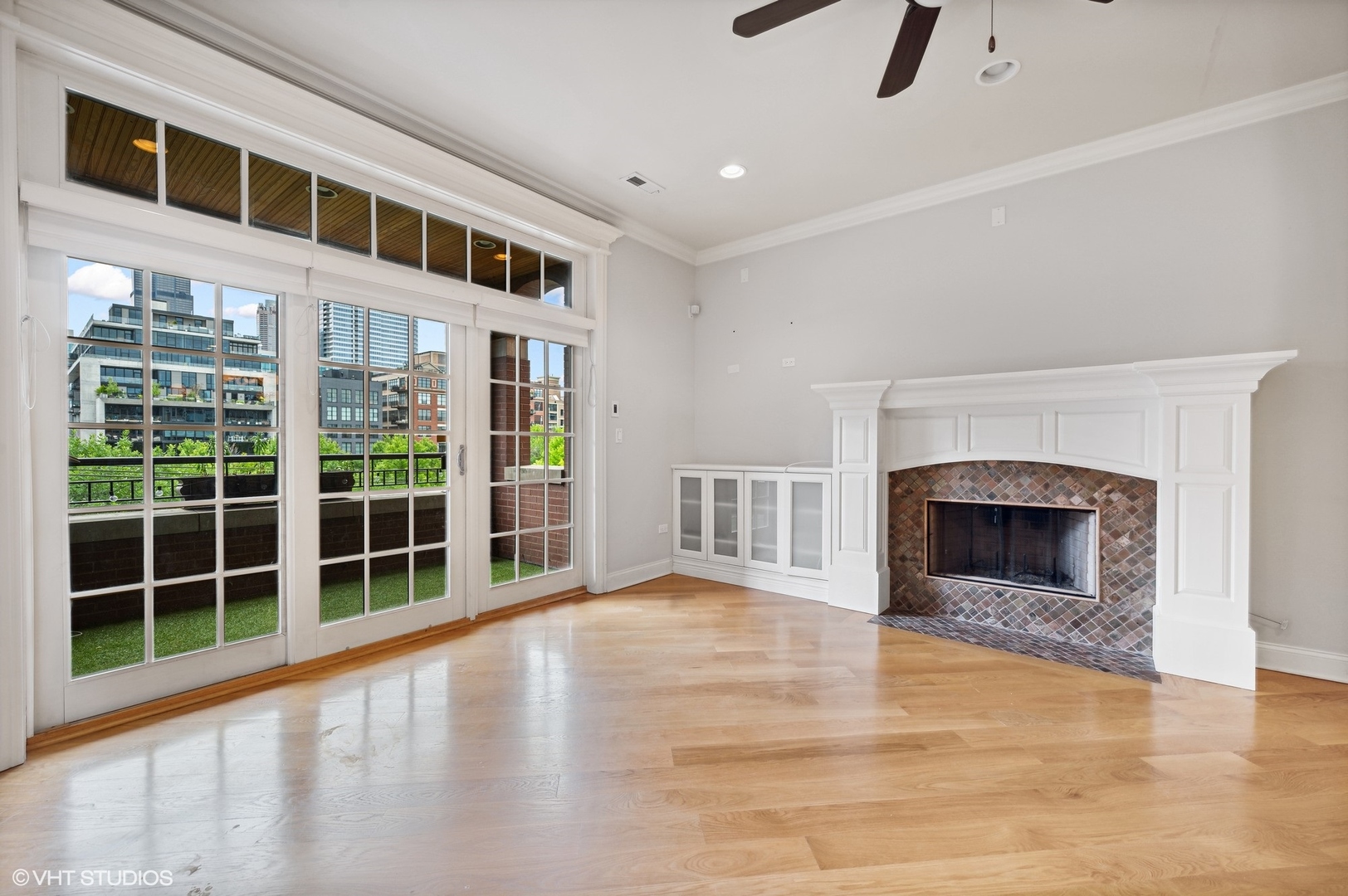 106 South Sangamon Street, Unit 3S Chicago, IL 60607 - Photo 5 of 20 a view of an empty room with furniture and a fireplace