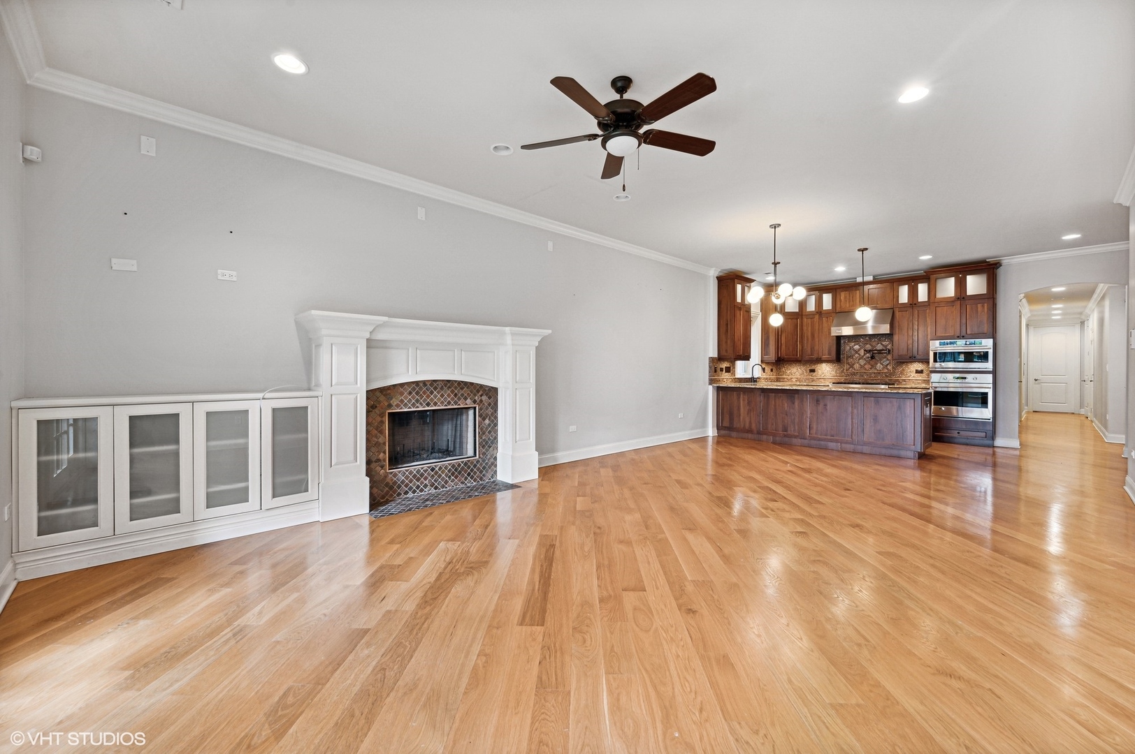 106 South Sangamon Street, Unit 3S Chicago, IL 60607 - Photo 6 of 20 an empty room with wooden floor fireplace and windows