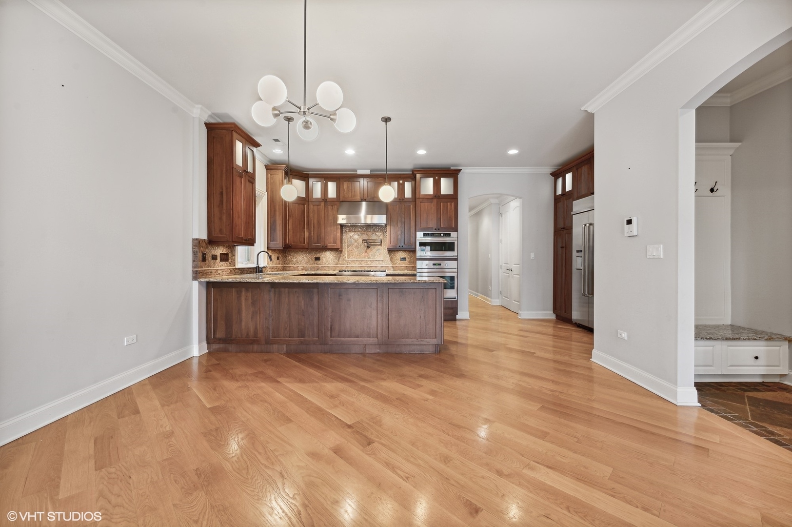 106 South Sangamon Street, Unit 3S Chicago, IL 60607 - Photo 7 of 20 a view of kitchen and dining area with chandelier