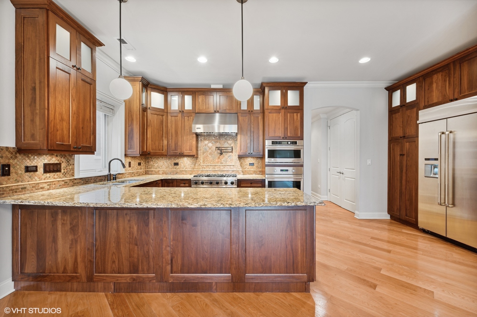 106 South Sangamon Street, Unit 3S Chicago, IL 60607 - Photo 8 of 20 a kitchen with stainless steel appliances granite countertop a sink refrigerator and cabinets