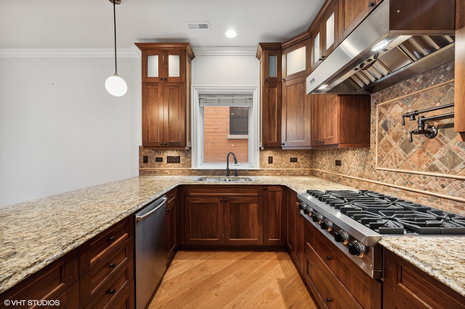 106 South Sangamon Street, Unit 3S Chicago, IL 60607 - Photo 10 of 20 a kitchen with stainless steel appliances granite countertop a sink stove and cabinets