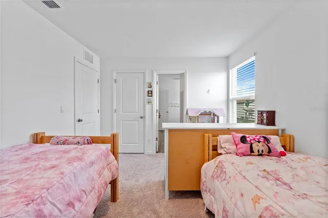 a bedroom with a bed and a closet