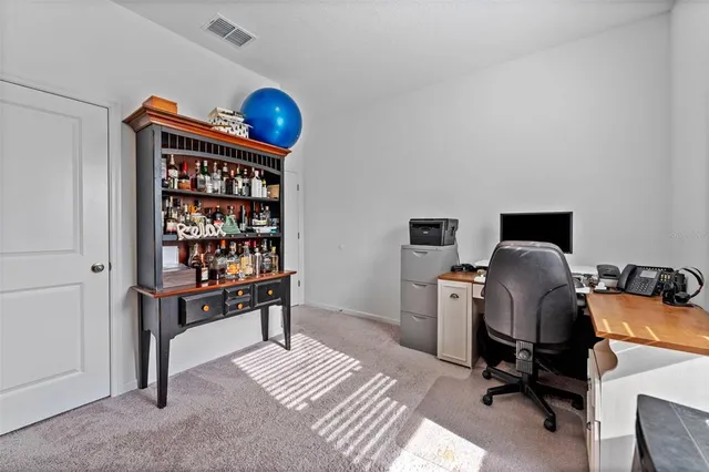 a view of workspace with wooden floor shelves