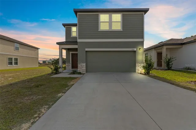 a view of a house with a yard