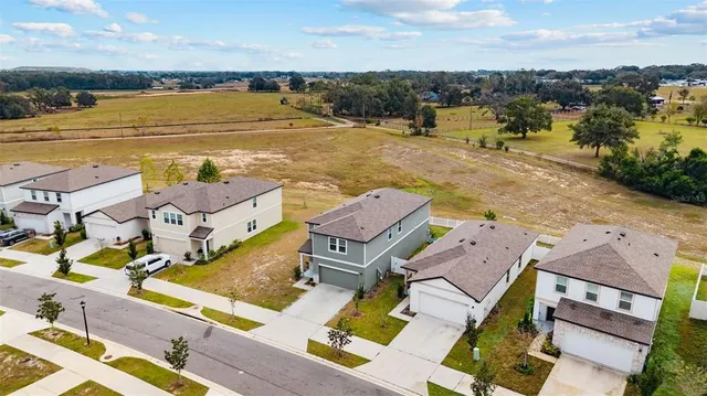 an aerial view of a city with ocean view