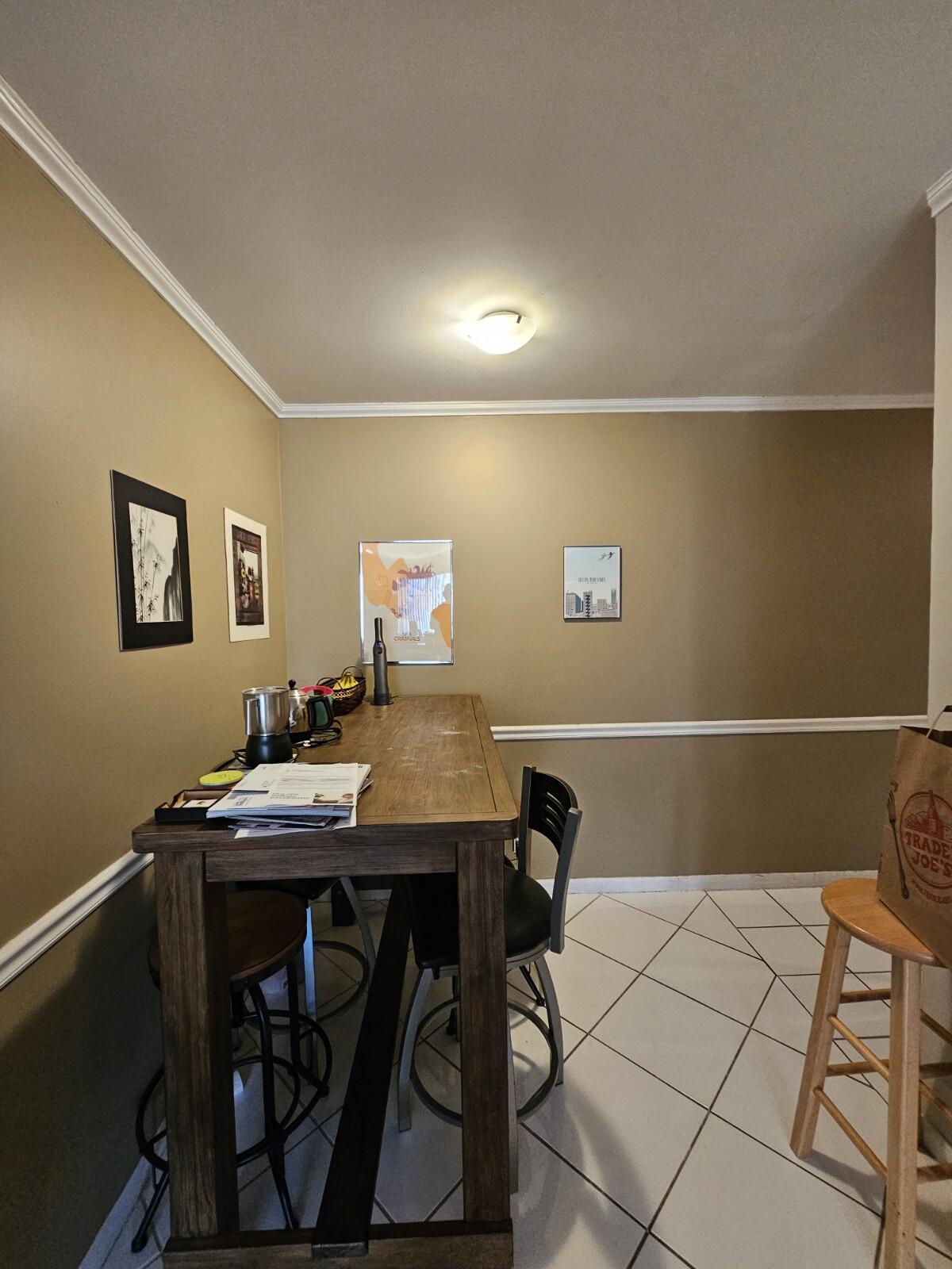 119 Northeast 19th Court, Unit 211G Wilton Manors, FL 33305 - Photo 13 of 21 a view of a workspace with furniture