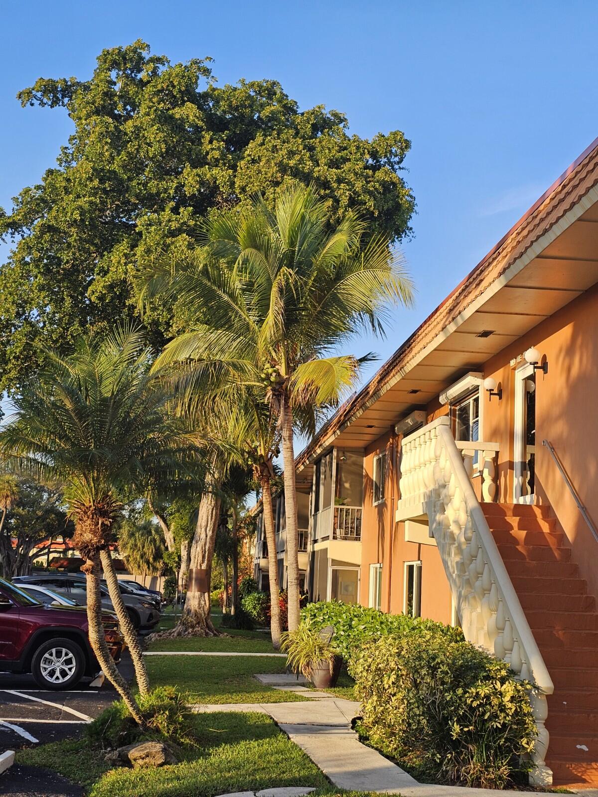 119 Northeast 19th Court, Unit 211G Wilton Manors, FL 33305 - Photo 20 of 21 front view of a house with a yard