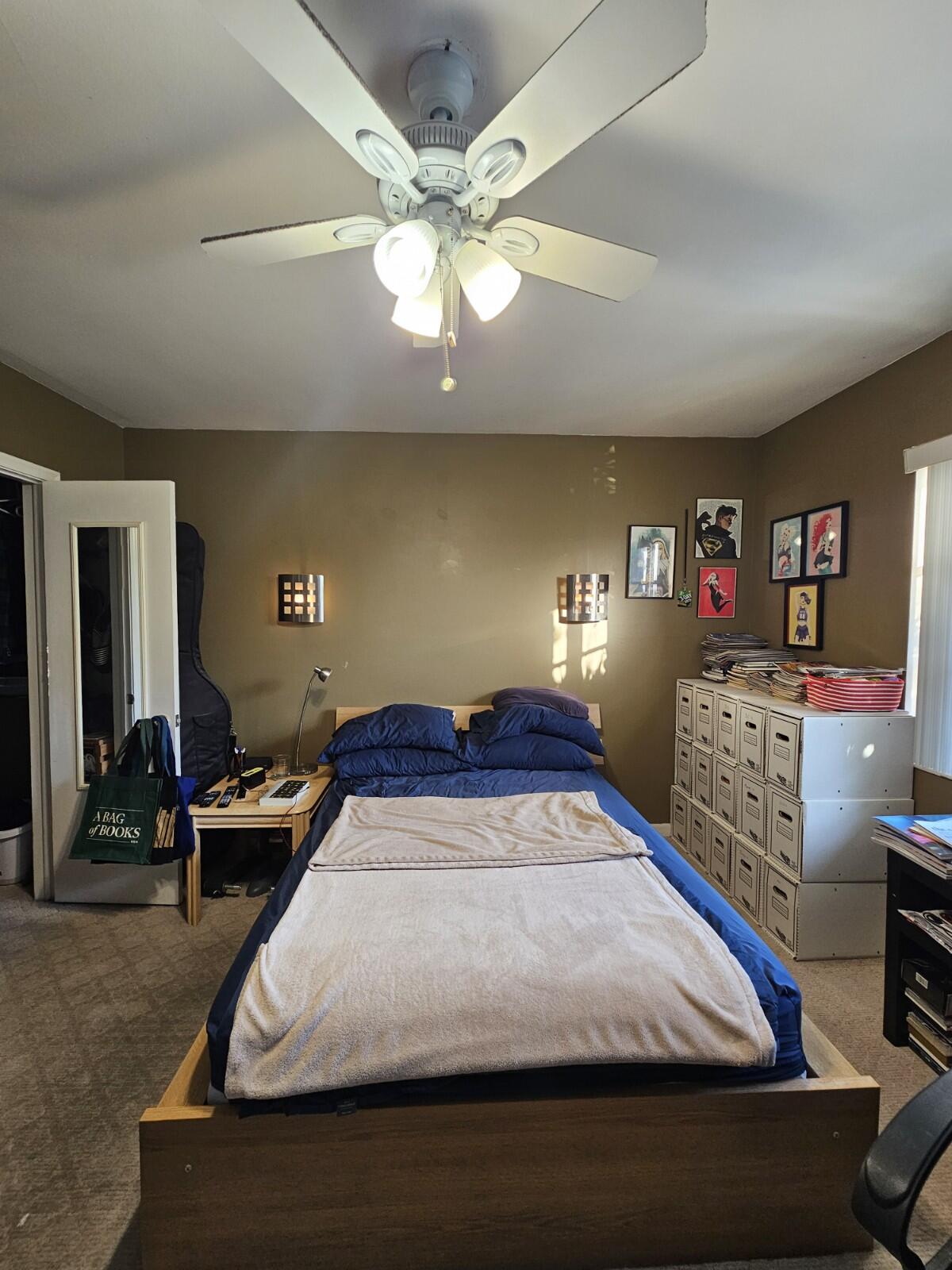 119 Northeast 19th Court, Unit 211G Wilton Manors, FL 33305 - Photo 9 of 21 a bedroom with a bed and gym equipment