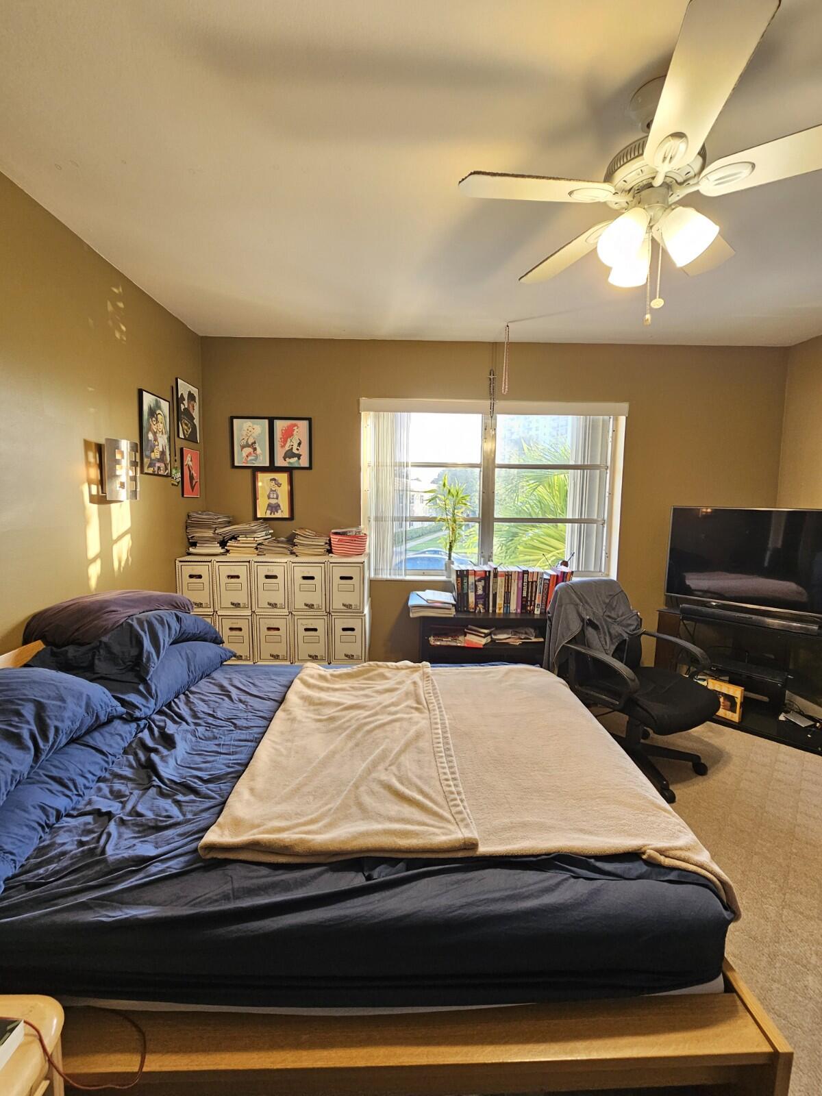 119 Northeast 19th Court, Unit 211G Wilton Manors, FL 33305 - Photo 10 of 21 a living room with furniture and a flat screen tv