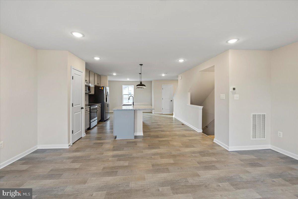 34 Scoter Road Hedgesville, WV 25427 - Photo 9 of 26 Similar Great room to kitchen view