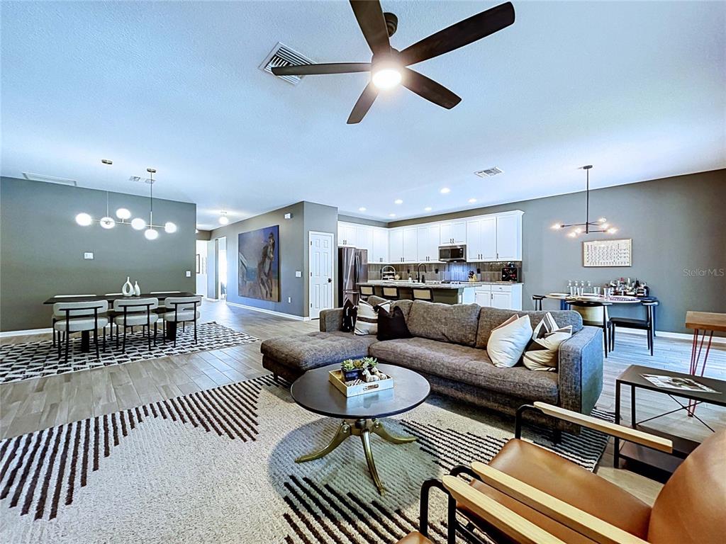 18078 Romanesque Court Spring Hill, FL 34610 - Photo 22 of 81 a living room with furniture and a view of kitchen