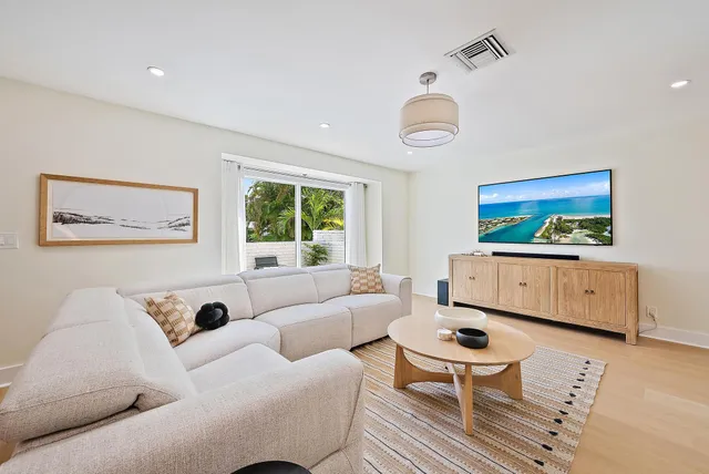 a bedroom with furniture and a flat screen tv