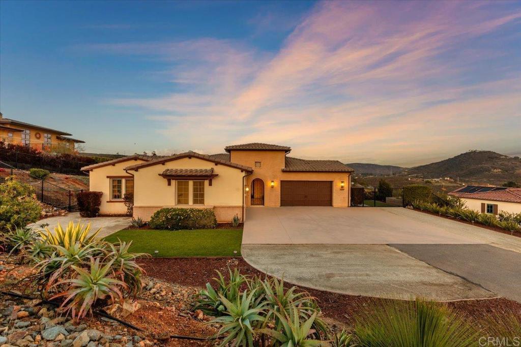 3849 Rancho Summit Drive Encinitas, CA 92024 - Photo 14 of 63 front view of a house with a yard