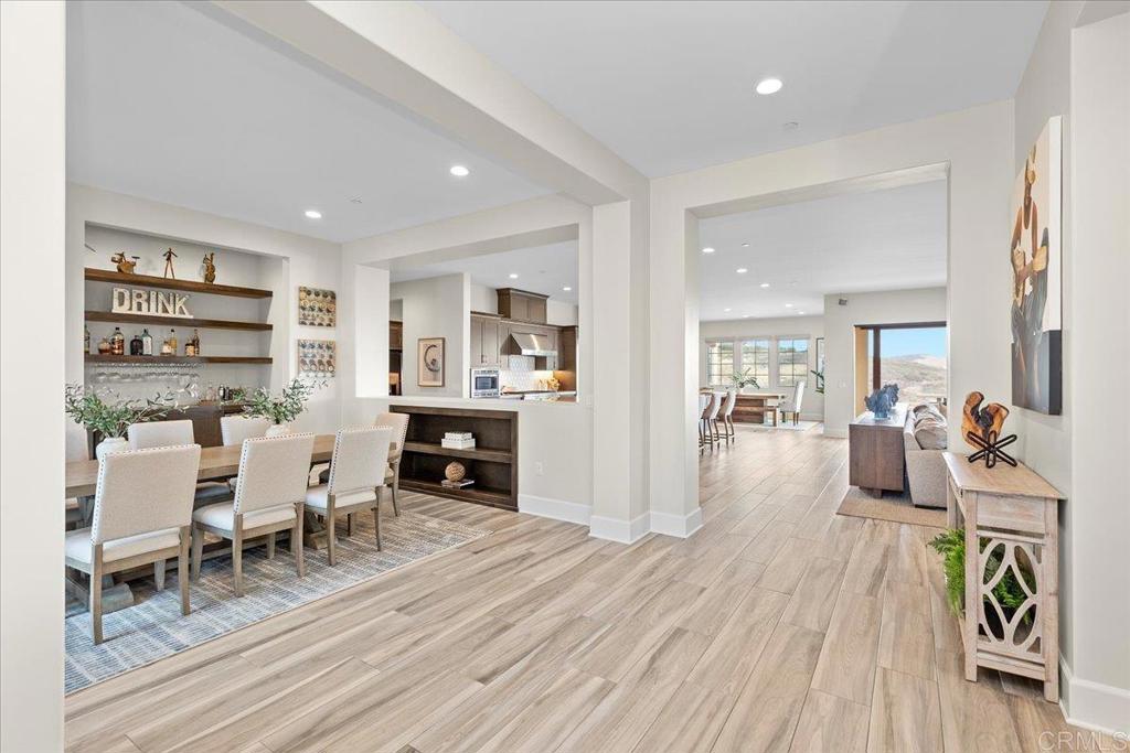 3849 Rancho Summit Drive Encinitas, CA 92024 - Photo 19 of 63 a living room with furniture and a wooden floor