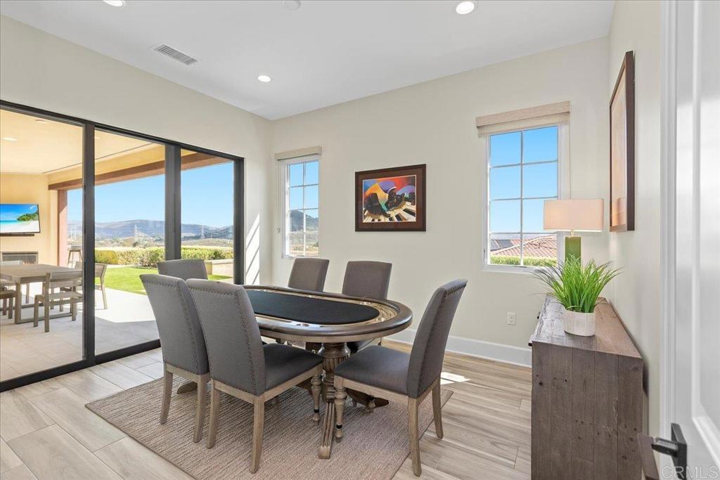 3849 Rancho Summit Drive Encinitas, CA 92024 - Photo 40 of 63 a view of a dining room with furniture window and wooden floor