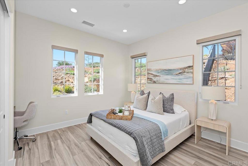 3849 Rancho Summit Drive Encinitas, CA 92024 - Photo 45 of 63 a bedroom with a bed and a large window