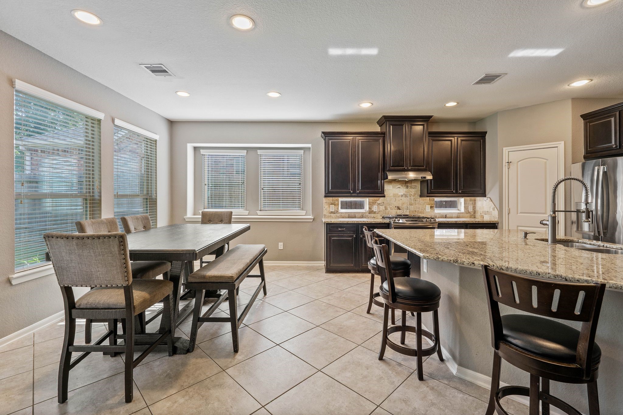 3544 Woods Estates Drive Conroe, TX 77304 - Photo 12 of 46 a view of a dining room with furniture window and outside view