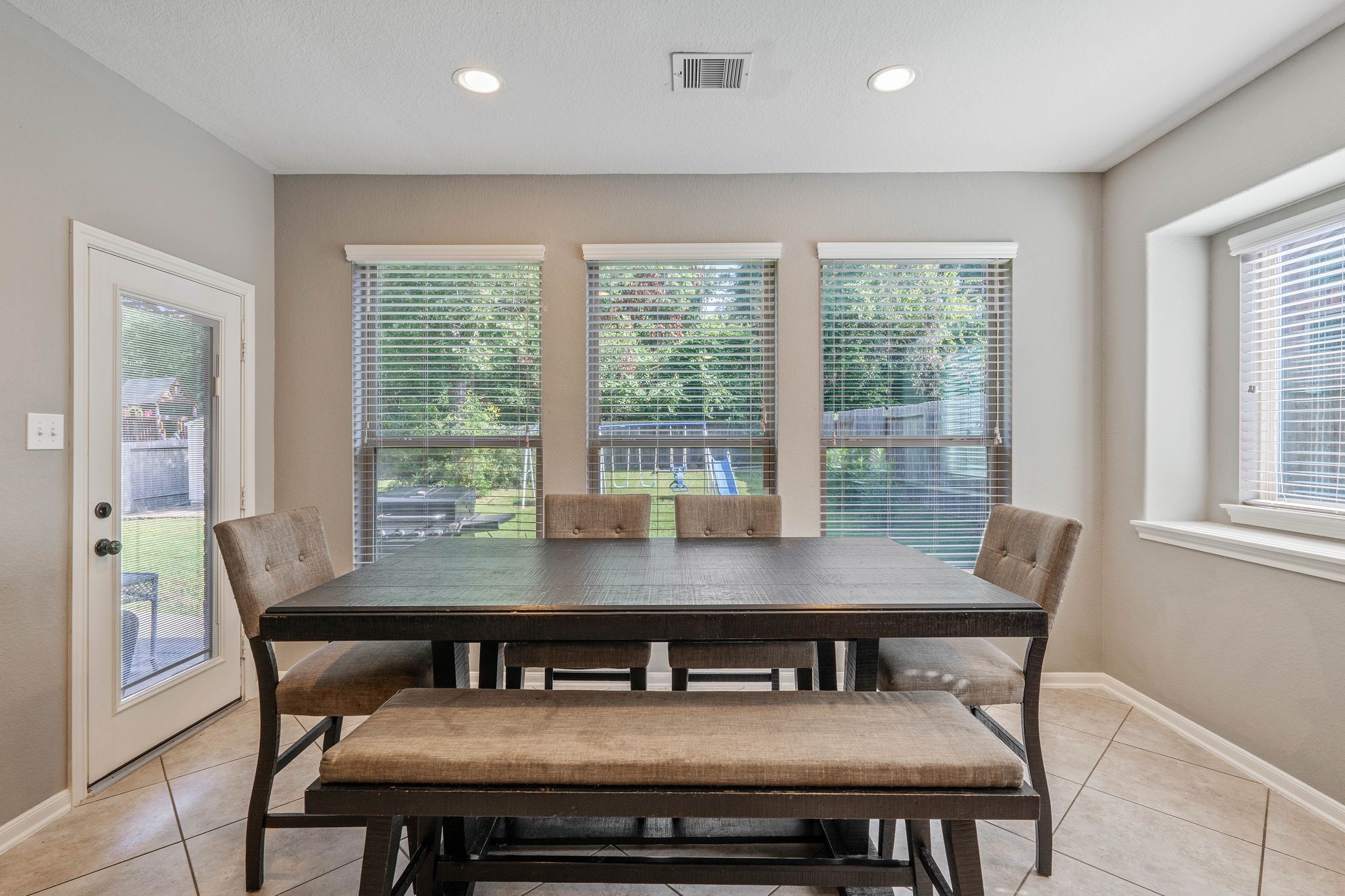 3544 Woods Estates Drive Conroe, TX 77304 - Photo 16 of 46 a view of a dining room with furniture and wooden floor