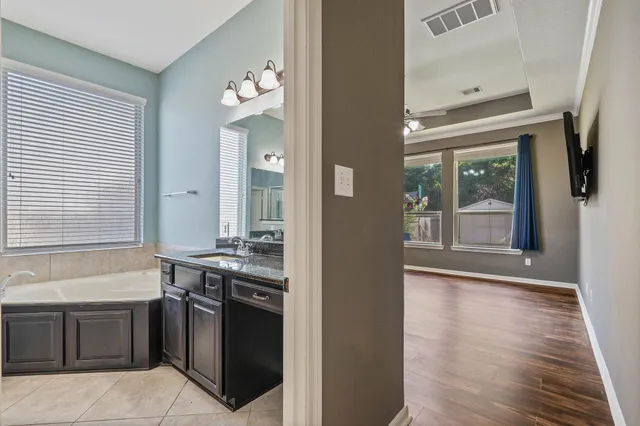 a kitchen with stainless steel appliances granite countertop a stove and a sink