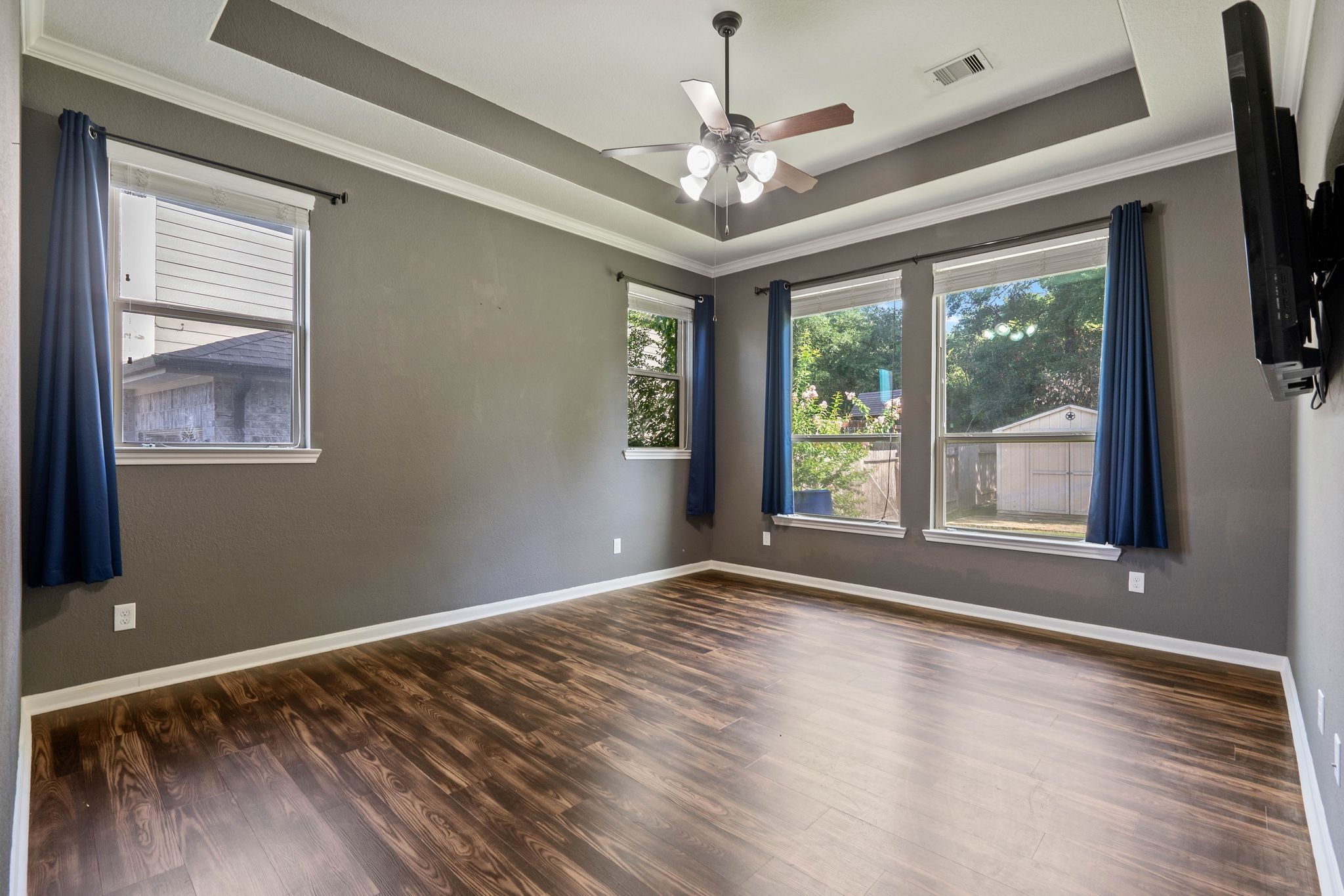 3544 Woods Estates Drive Conroe, TX 77304 - Photo 19 of 46 a view of an empty room with wooden floor and a window