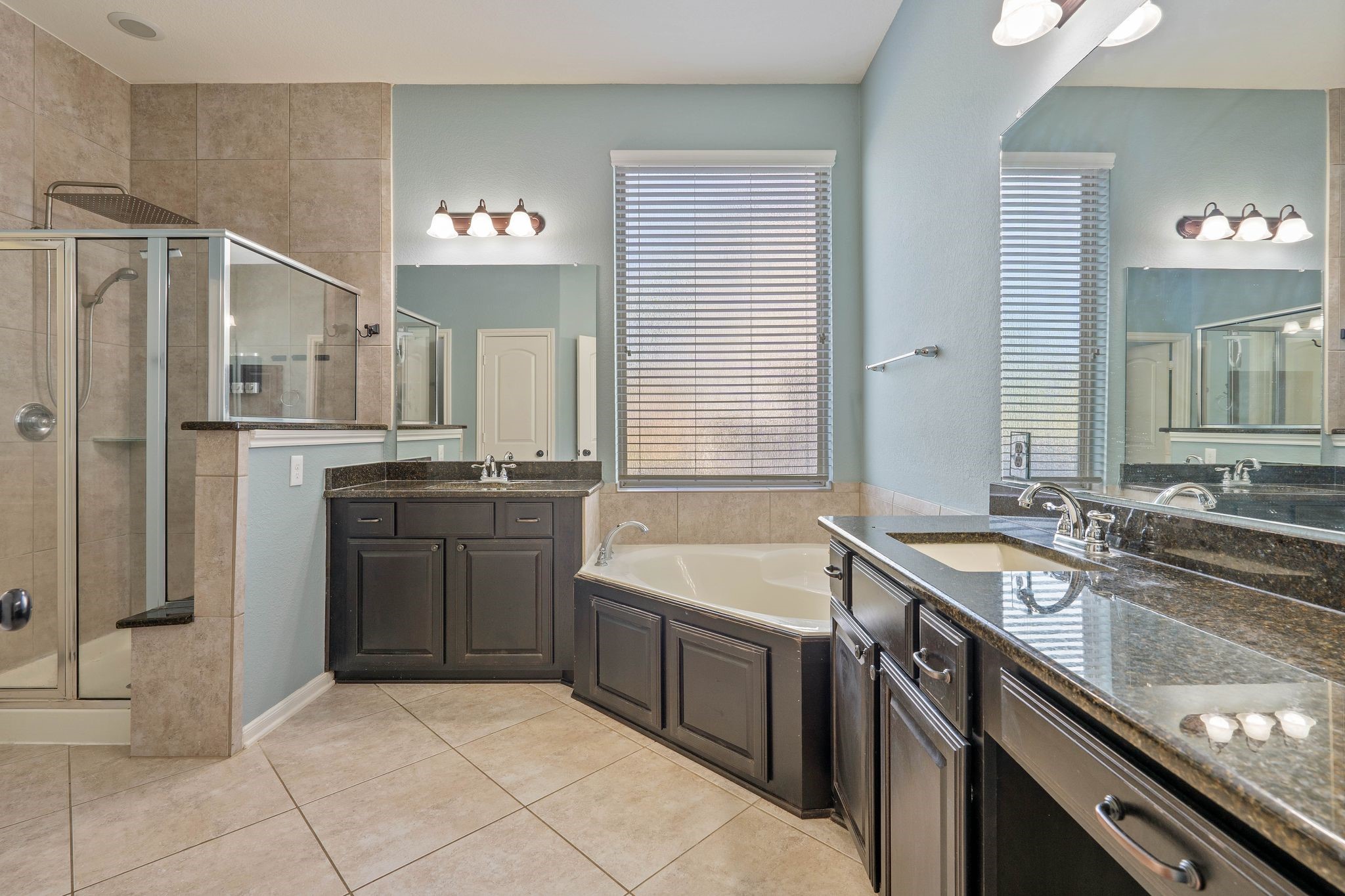3544 Woods Estates Drive Conroe, TX 77304 - Photo 21 of 46 a kitchen with a sink stove and refrigerator