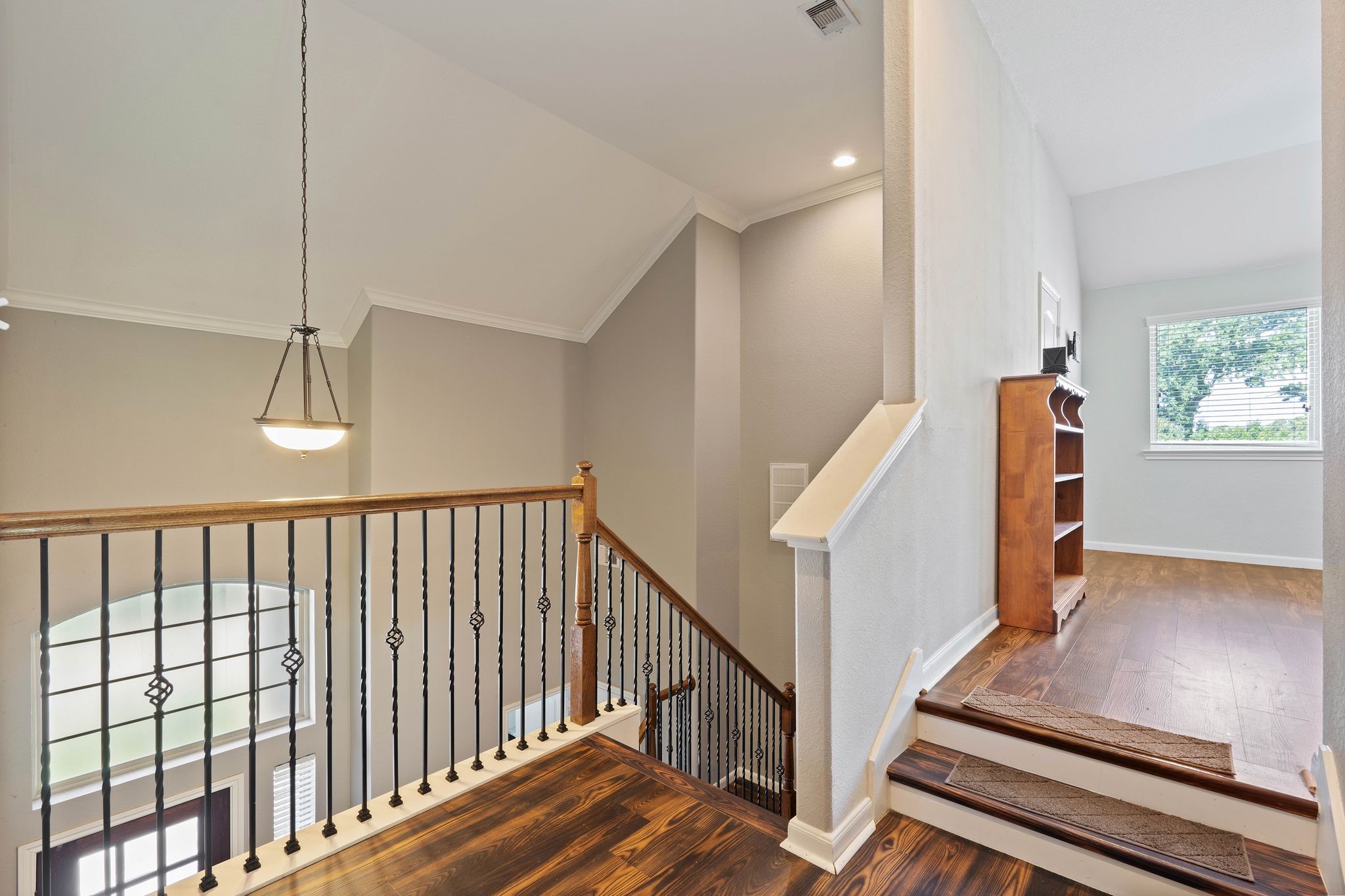 3544 Woods Estates Drive Conroe, TX 77304 - Photo 24 of 46 a view of staircase with lots of frames on wall and wooden floor