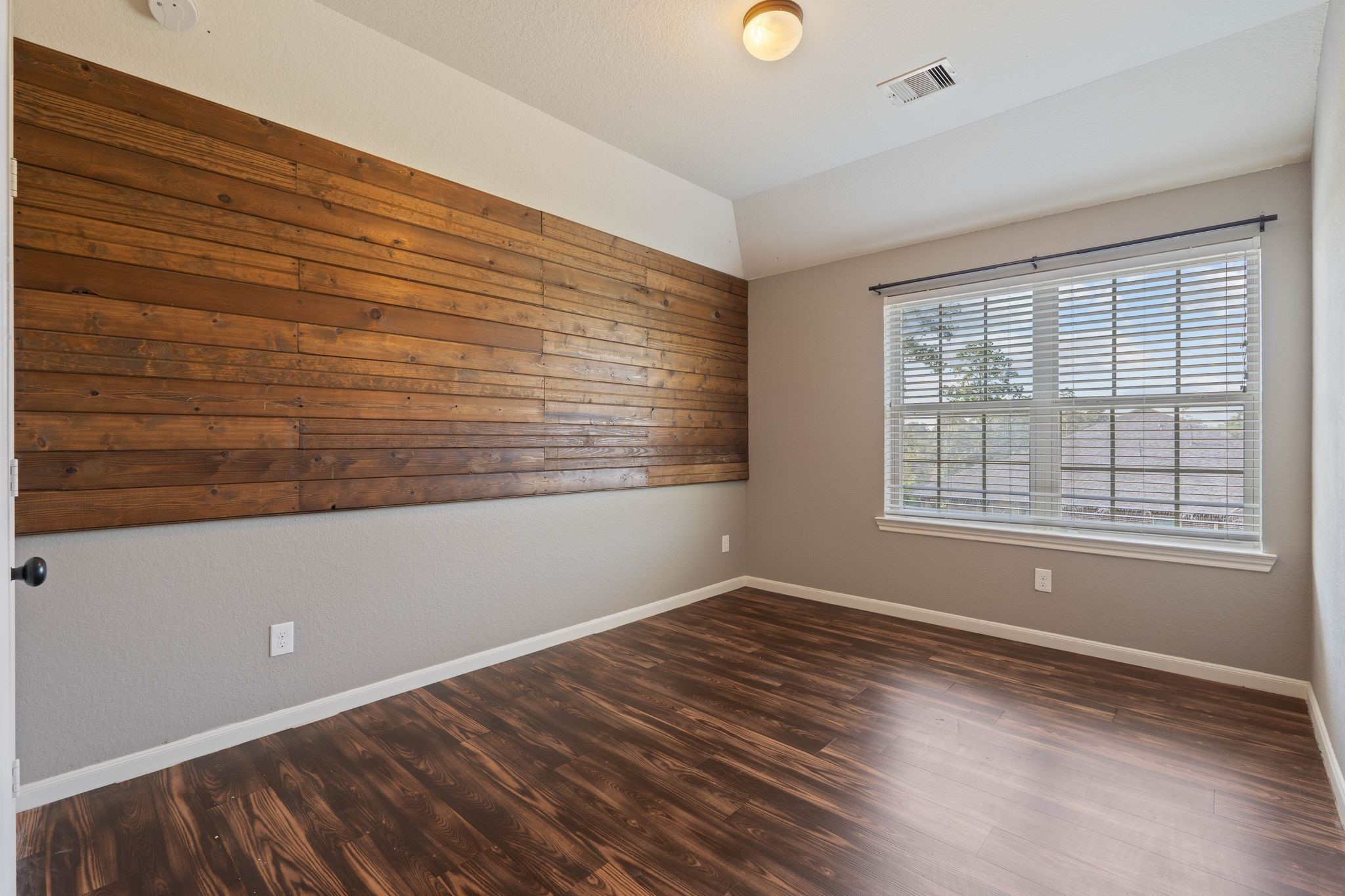 3544 Woods Estates Drive Conroe, TX 77304 - Photo 26 of 46 a view of a room with wooden floor and windows