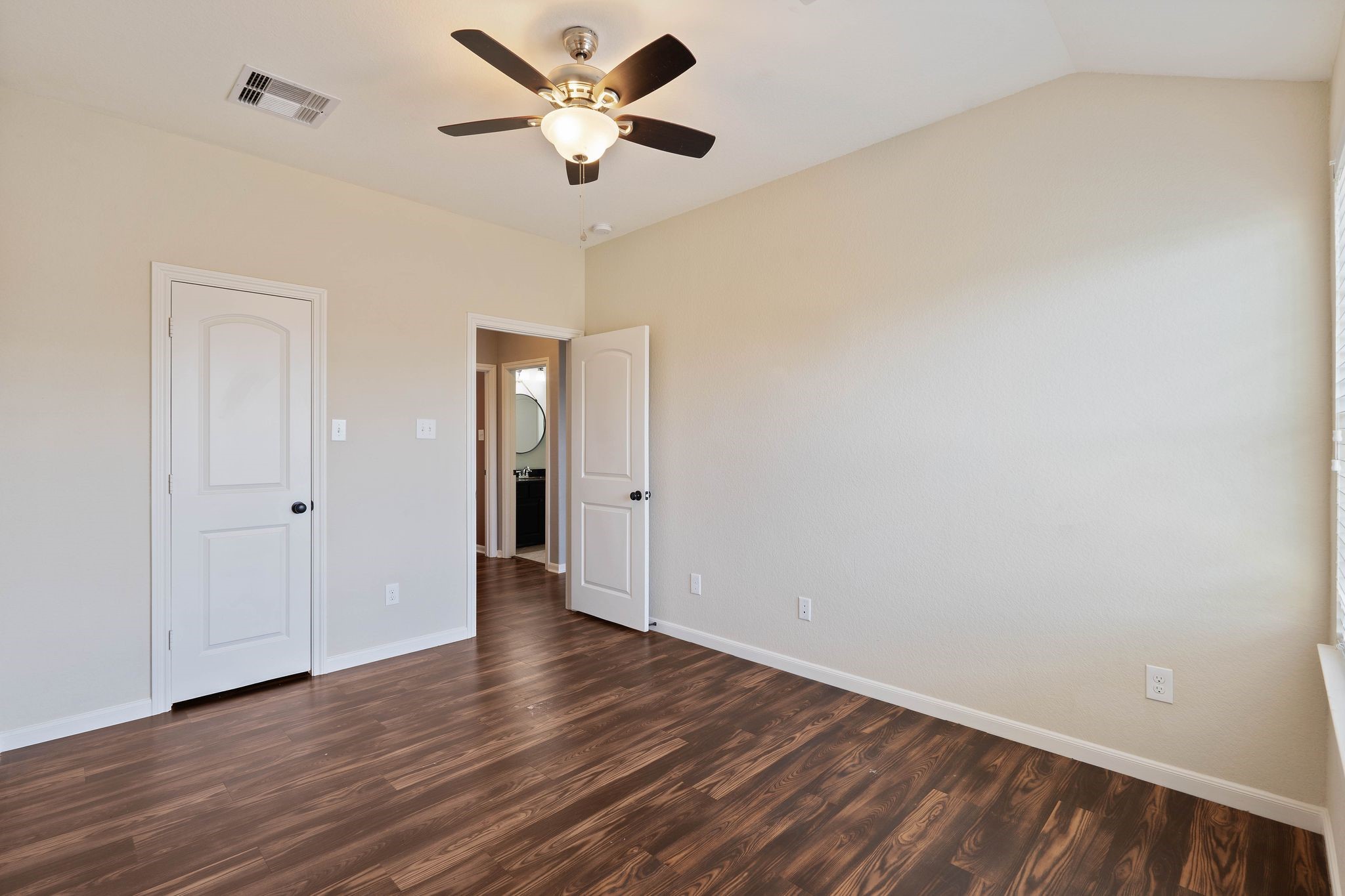 3544 Woods Estates Drive Conroe, TX 77304 - Photo 29 of 46 an empty room with wooden floor and a ceiling fan